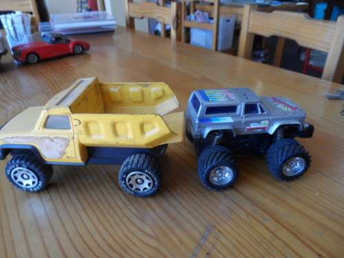 BUDDY L PRESSED METAL TIP TRUCK AND PLASTIC MONSTER TRUCK