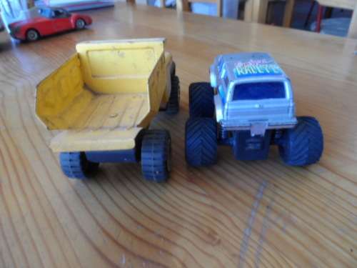 BUDDY L PRESSED METAL TIP TRUCK AND PLASTIC MONSTER TRUCK