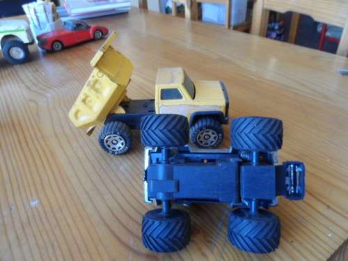 BUDDY L PRESSED METAL TIP TRUCK AND PLASTIC MONSTER TRUCK