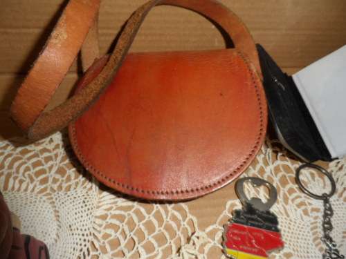 Variety of items from leather bag to beautiful little photo book with silver front