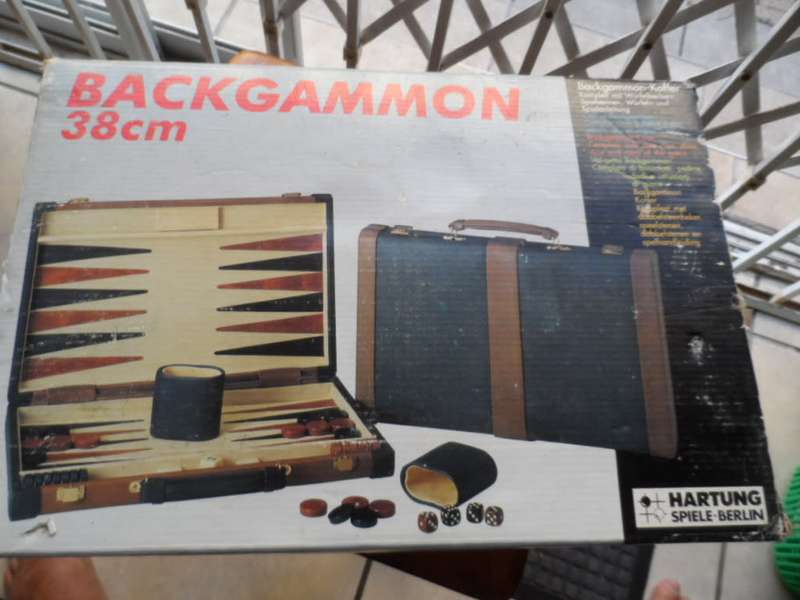 Beautiful Back gammon game in leather case and board like new.  all pieces there
