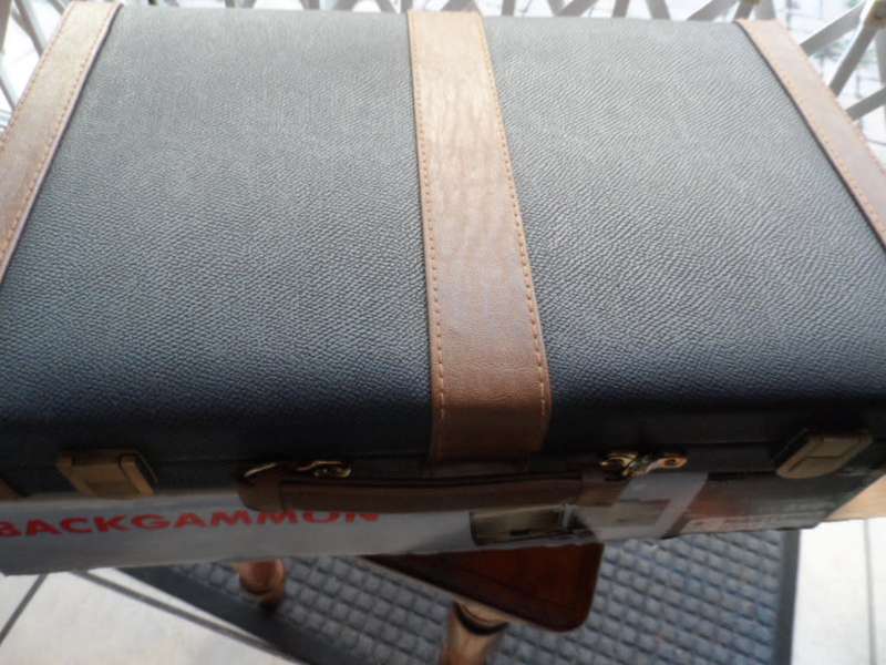 Beautiful Back gammon game in leather case and board like new.  all pieces there