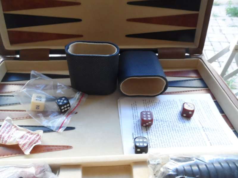Beautiful Back gammon game in leather case and board like new.  all pieces there