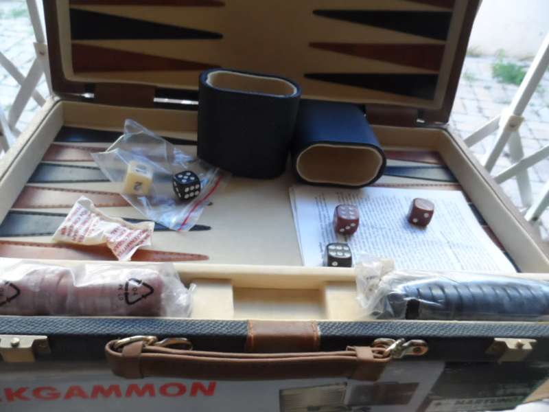 Beautiful Back gammon game in leather case and board like new.  all pieces there
