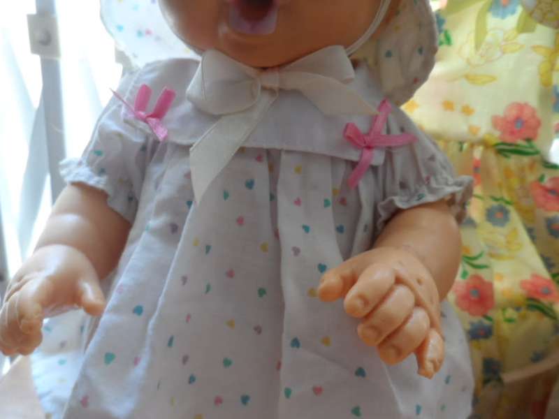 Two cuchiecoo dolls with original outfits plus 1 extra each and two bottles and 1 dummy