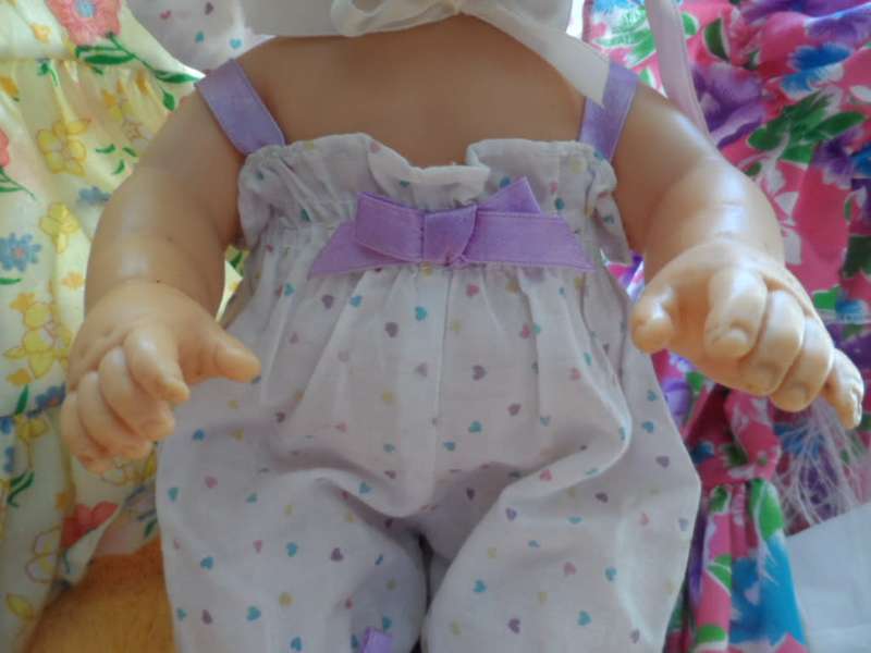 Two cuchiecoo dolls with original outfits plus 1 extra each and two bottles and 1 dummy