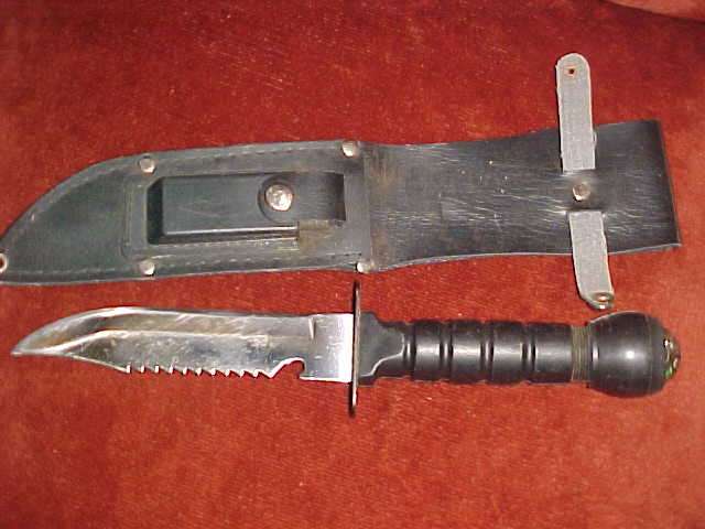 Knife with compass and sharpning stone on the casing