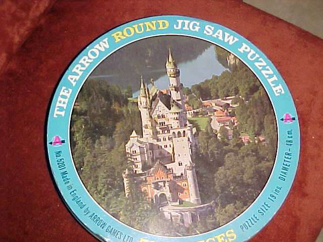 Round tin with puzzle unbuilt