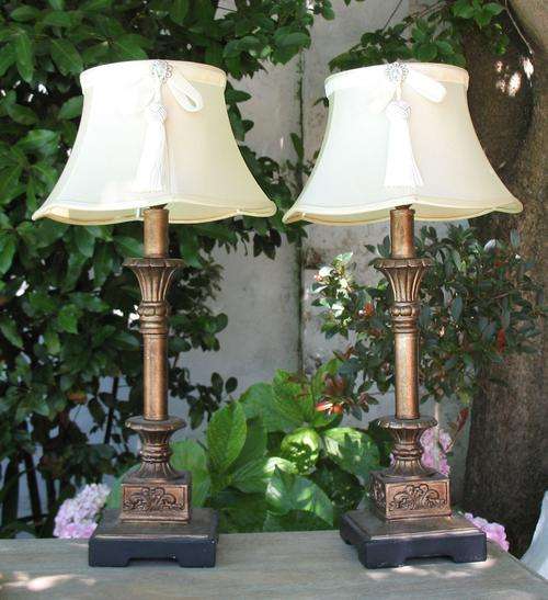 Vintage pair of cream lamps with aged copper bases and lovely tassles
