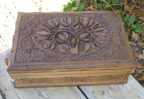 Old ornately carved wooden tree of life box