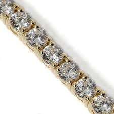 CLASSIC **10.5 CWT.** SIMULATED DIAMOND YELLOW GOLD PLATED TENNIS BRACELET.