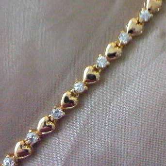 LOVELY! TENNIS BRACELET WITH HEARTS & DIAMOND CZ IN 18ct YELLOW GOLD PLATED over 925 SILVER.