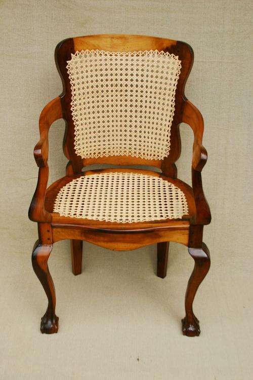 Stinkwood ball & claw armchair with new cane