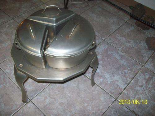 Unique three-legged cast iron stove with 3 cast iron cooking pots