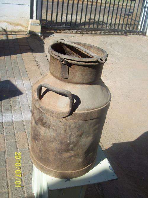 Old 5 gallon milk can for decorating, 2 small rust holes on the bottom