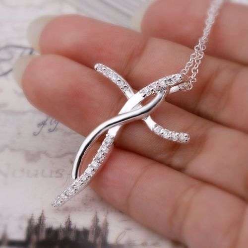 A beautiful silver cross pendant with Austrian crystals - Necklace included