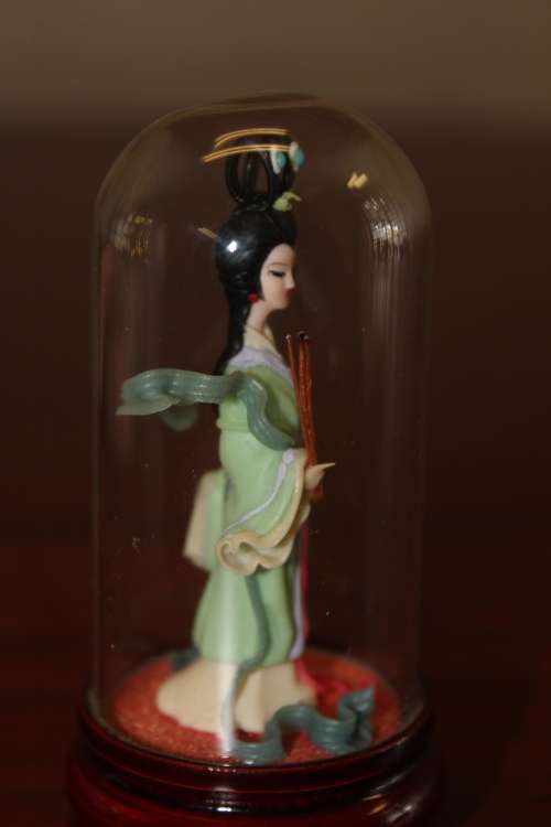 Vintage Hand Sculpted Miniature Japanese Geisha in green dress on wooden base with glass dome 8.6cm