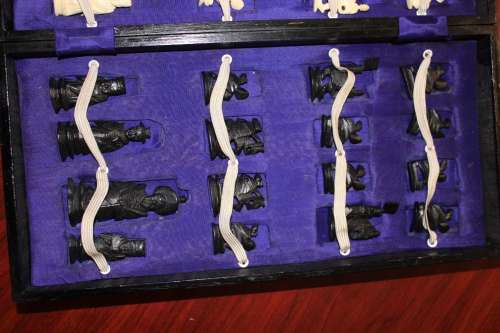 ANTIQUE CHINESE HANDCARVED and STAINED BONE CHESS SET WITH LACQUERED WOODEN BOARD/CASE 34 BY 35 CM