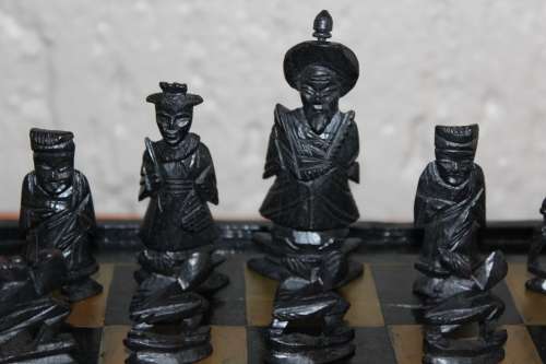 ANTIQUE CHINESE HANDCARVED and STAINED BONE CHESS SET WITH LACQUERED WOODEN BOARD/CASE 34 BY 35 CM