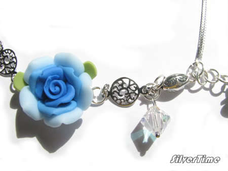 Genuine Swarovski Crystal Beads and Clay Flowers on Sterling Silver Bracelet