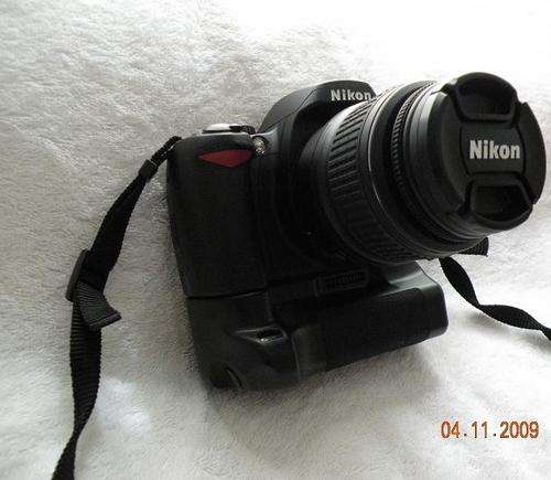 Nikon D60 SLR + 18-55 II Lens + battery grip + remote, 2 months old. BARGAIN!!