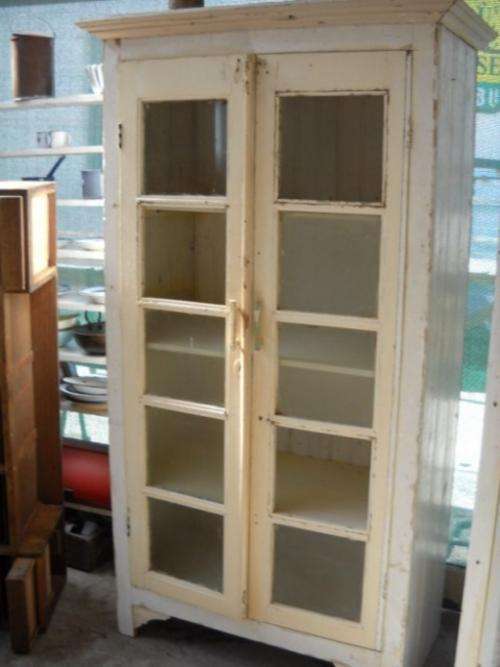 KIMS CREATIONS.  VERY OLD PAINTED CUPBOARD WITH GLASS PANES IN DOORS.