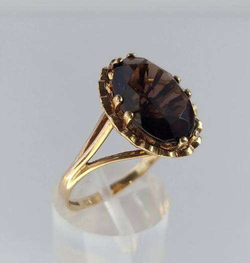 9 carat gold ring set with large rich brown topaz (1970s)