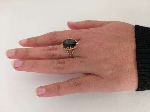 9 carat gold ring set with large rich brown topaz (1970s)