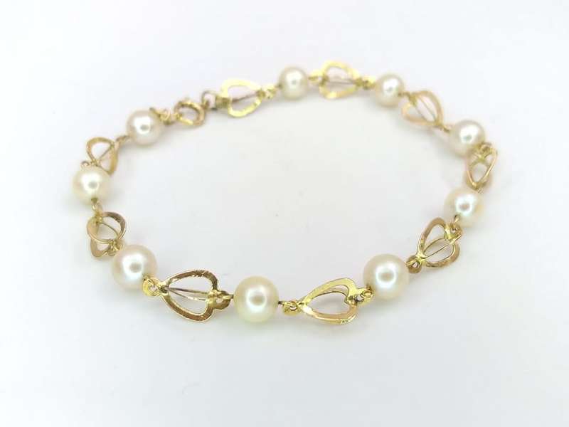 Pretty 14ct gold heart shaped link pearl bracelet