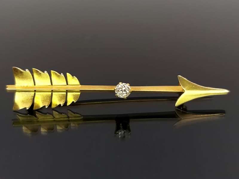 Edwardian 18ct gold and diamond Cupid`s arrow brooch