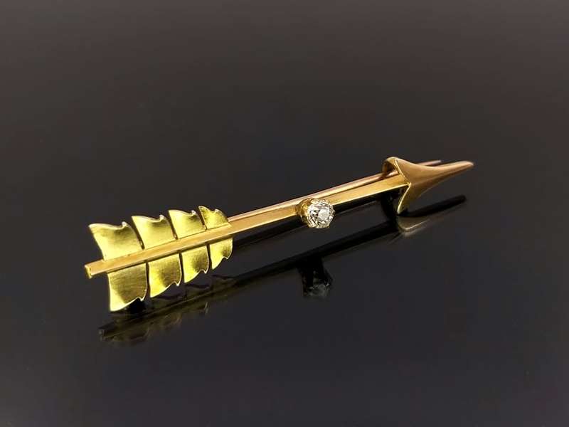 Edwardian 18ct gold and diamond Cupid`s arrow brooch
