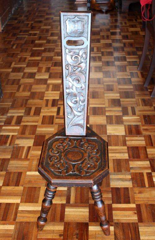 Antique hand carved spinning wheel chair