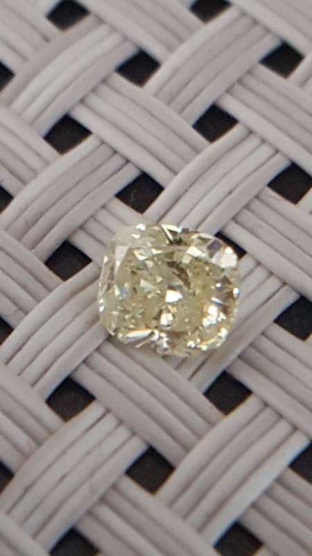Cert 0.62Cts Fancy Yellow SI2 Cushion Natural Diamond