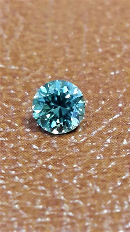 Moissonite 0.55Ct Blue Round Brilliant Cut