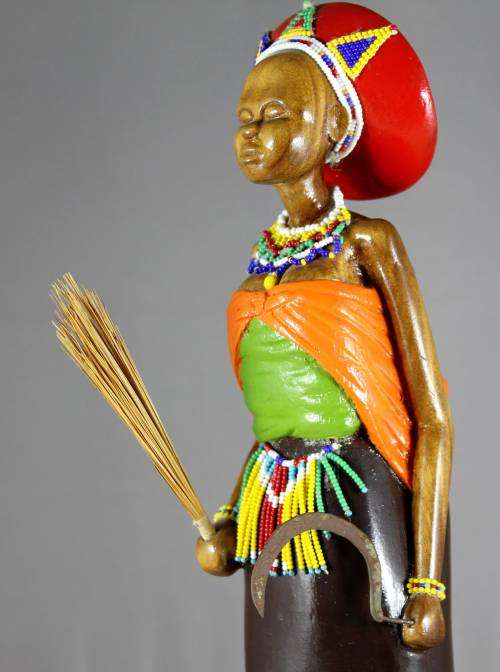 HR Mbhele - Woman With Baby holding sickle and broom