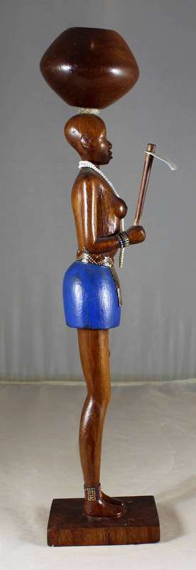 HR Mbhele - Woman Carrying Large Pot and hoe