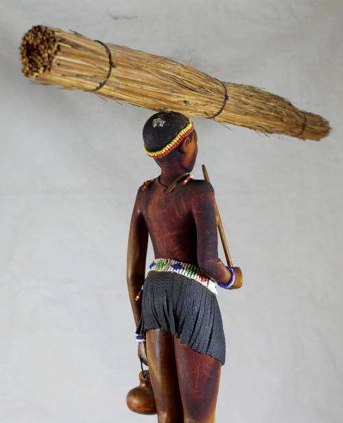 HR Mbhele - Woman Carrying Large Bundle of Reeds
