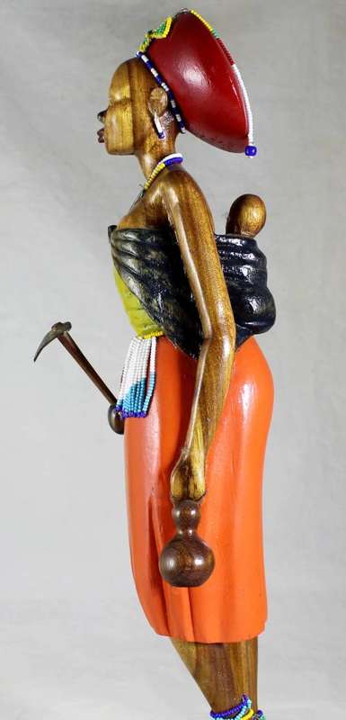 HR Mbhele - Traditional Mother and Child Carrying a Hoe
