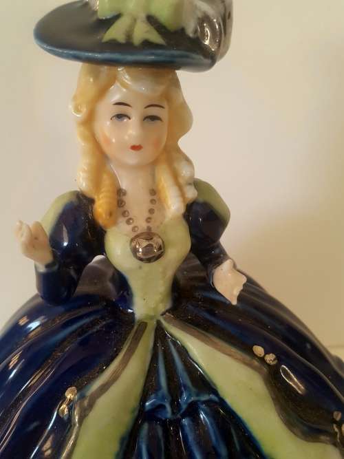 Must see musical figurine. Wind up with a crown and s stamp