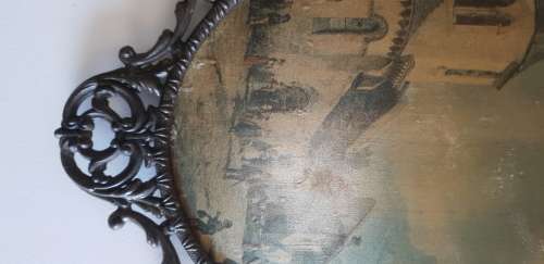 Vintage metal frame with a domed glass and painted on silk picture.