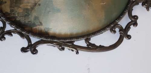Vintage metal frame with a domed glass and painted on silk picture.