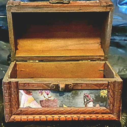 Silk inlaid wooden jewelry box.