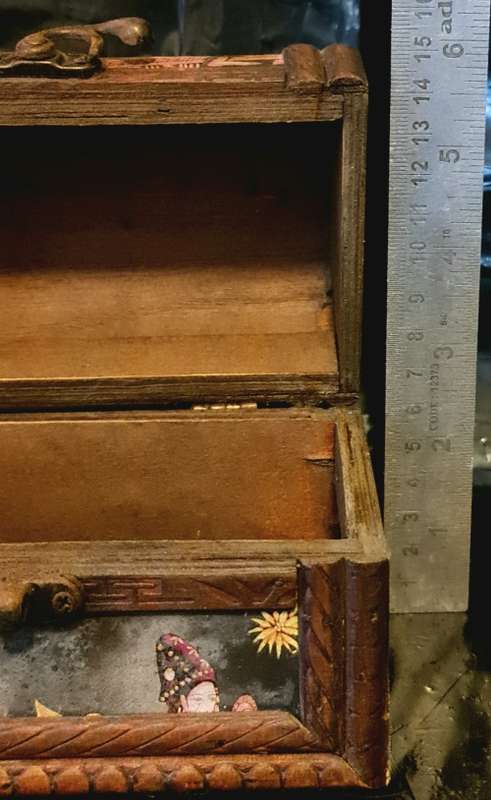 Silk inlaid wooden jewelry box.