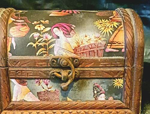 Silk inlaid wooden jewelry box.