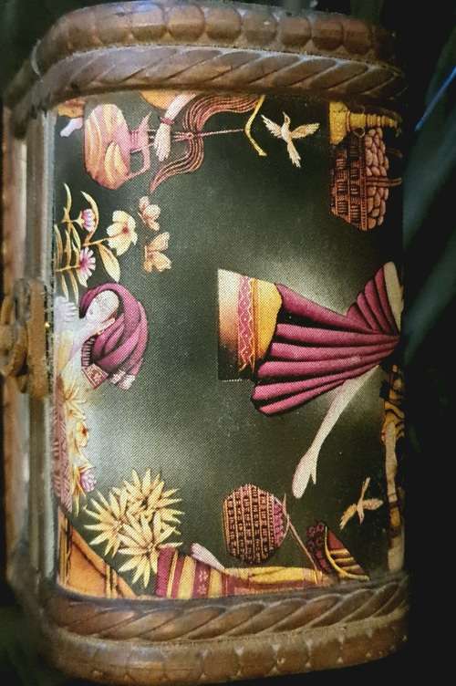 Silk inlaid wooden jewelry box.