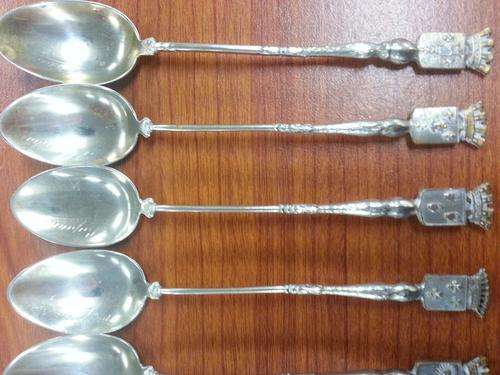 6 spoons displaying different german badges with engraving on the spoons