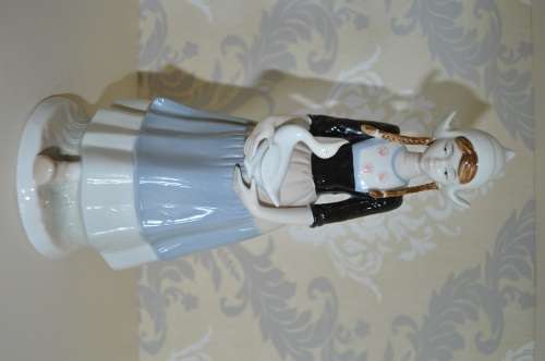 dutch girl with duck excellent quality like lladro