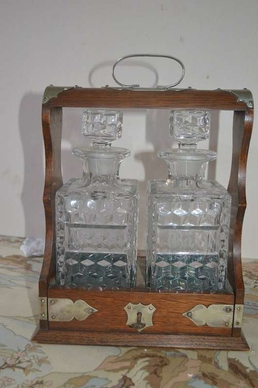 Beautiful 2 bottle oak  tantalus with original key