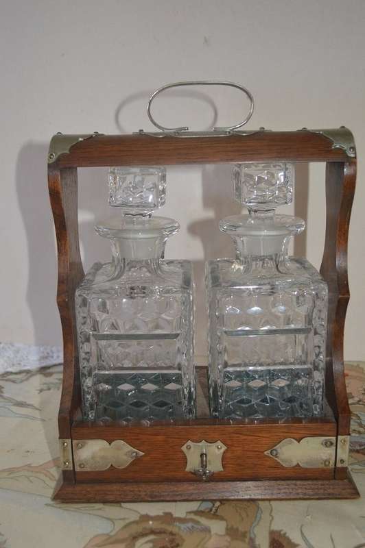 Beautiful 2 bottle oak  tantalus with original key