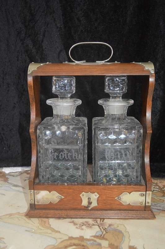 Beautiful 2 bottle oak  tantalus with original key